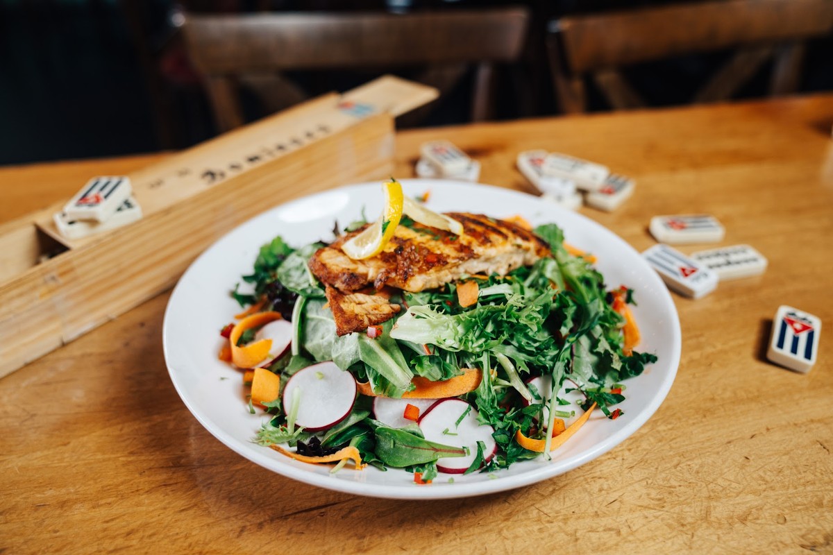 Grilled chicken salad, with mixed greens, carrots, radishes and peppers
